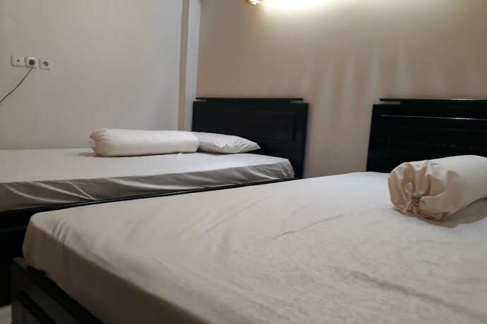 Imagen de la habitación del Hotel OYO 91162 Homestay Ansyariah Syariah. Foto 14