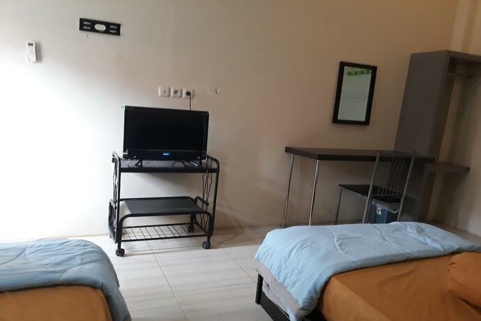 Imagen de la habitación del Hotel OYO 91162 Homestay Ansyariah Syariah. Foto 15