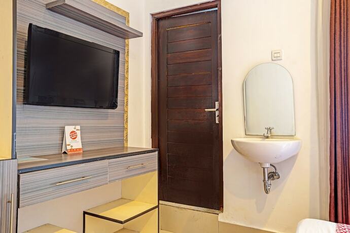 Imagen de la habitación del Hotel OYO 91204 Napura Homestay. Foto 17