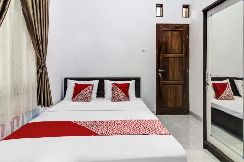 Imagen de la habitación del Hotel OYO 91243 Bina Syariah Guest House. Foto 20