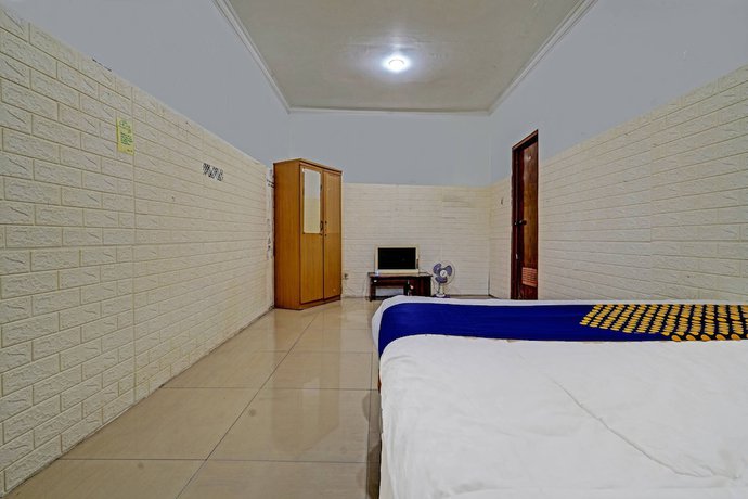Imagen de la habitación del Hotel OYO 91330 City Munigar Residence Syariah. Foto 11