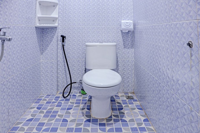 Imagen de la habitación del Hotel OYO 91419 Mulia Bangka. Foto 2