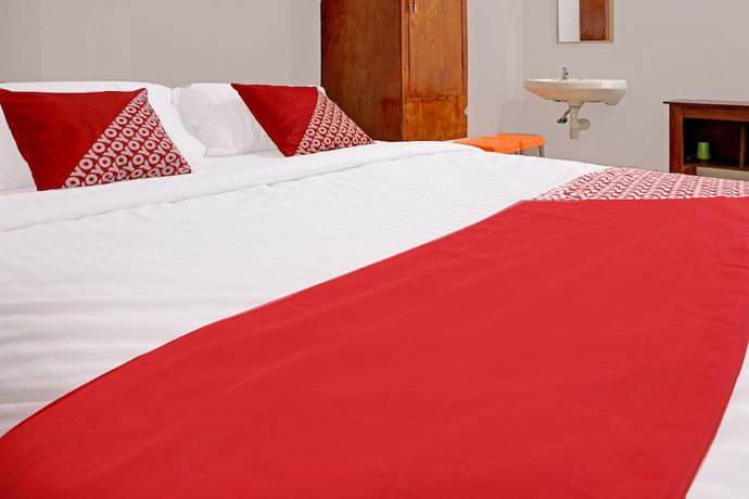 Imagen de la habitación del Hotel OYO 91419 Mulia Bangka. Foto 4