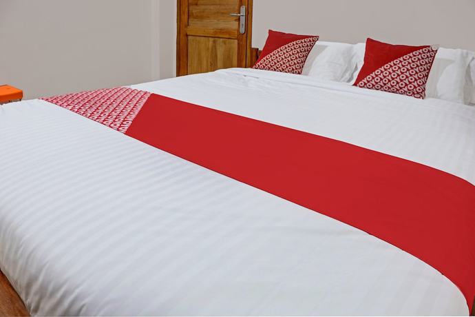 Imagen de la habitación del Hotel OYO 91419 Mulia Bangka. Foto 5