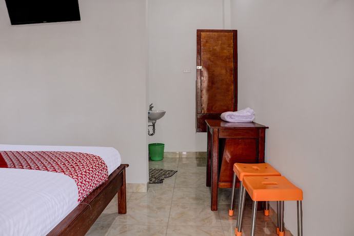 Imagen de la habitación del Hotel OYO 91419 Mulia Bangka. Foto 7