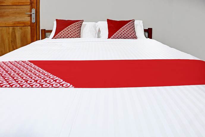 Imagen de la habitación del Hotel OYO 91419 Mulia Bangka. Foto 10