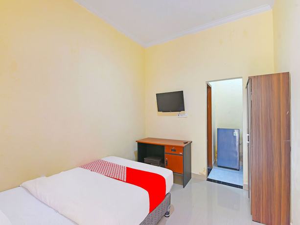 Imagen de la habitación del Hotel OYO 91445 Sandat Guest House. Foto 3
