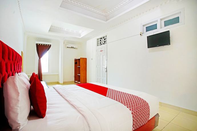 Imagen de la habitación del Hotel OYO 91460 Guest House Kencana Syariah. Foto 12