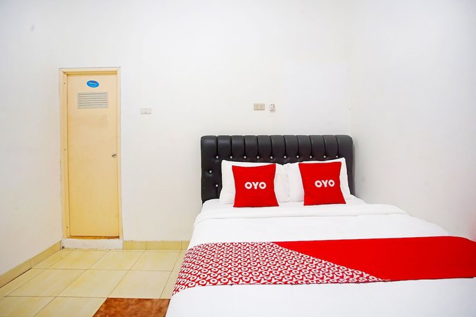 Imagen de la habitación del Hotel OYO 91460 Guest House Kencana Syariah. Foto 13