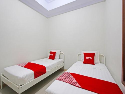 Imagen de la habitación del Hotel OYO 91487 Ib Homestay Syariah. Foto 19