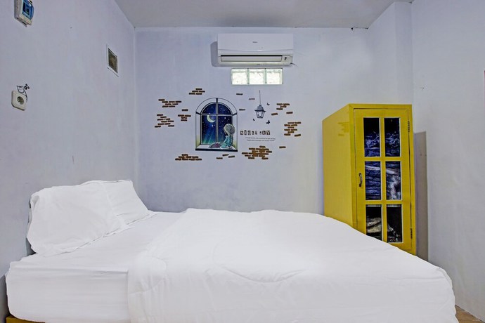 Imagen de la habitación del Hotel OYO 91506 Kedai Cinta Guest House. Foto 2
