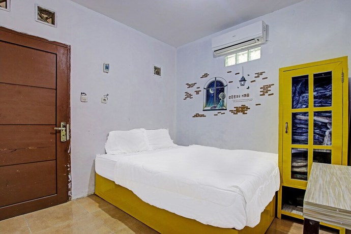 Imagen de la habitación del Hotel OYO 91506 Kedai Cinta Guest House. Foto 4