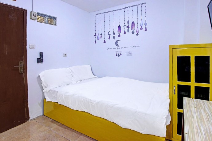 Imagen de la habitación del Hotel OYO 91506 Kedai Cinta Guest House. Foto 5