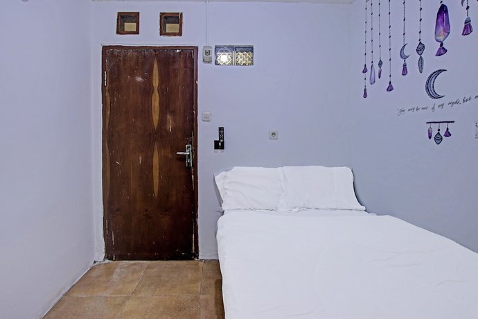Imagen de la habitación del Hotel OYO 91506 Kedai Cinta Guest House. Foto 7