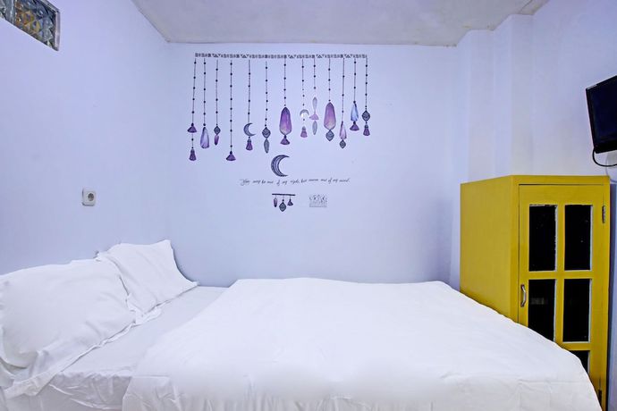 Imagen de la habitación del Hotel OYO 91506 Kedai Cinta Guest House. Foto 8
