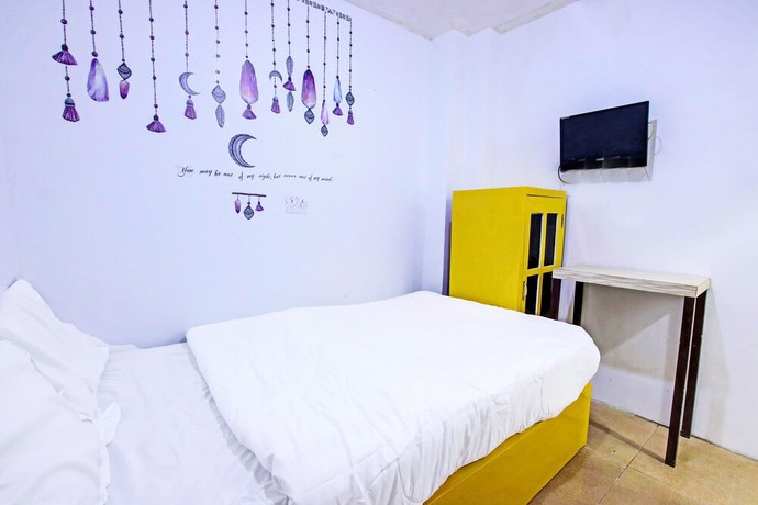 Imagen de la habitación del Hotel OYO 91506 Kedai Cinta Guest House. Foto 9