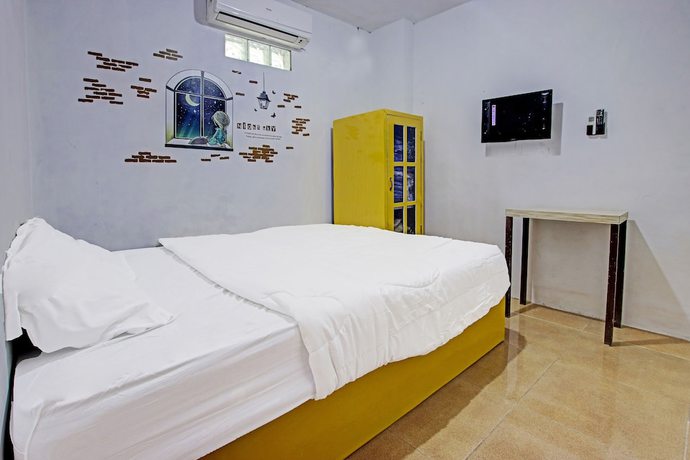 Imagen de la habitación del Hotel OYO 91506 Kedai Cinta Guest House. Foto 10