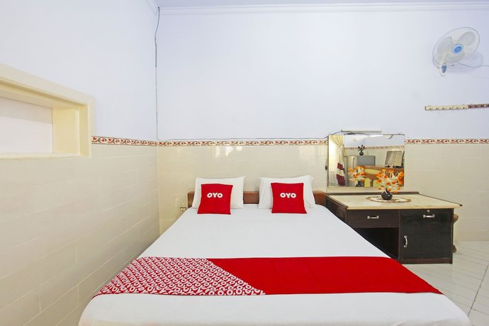 Imagen de la habitación del Hotel OYO 91516 Wisata. Foto 2