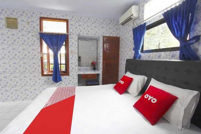 Imagen de la habitación del Hotel OYO 91516 Wisata. Foto 4