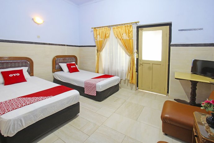 Imagen de la habitación del Hotel OYO 91516 Wisata. Foto 5