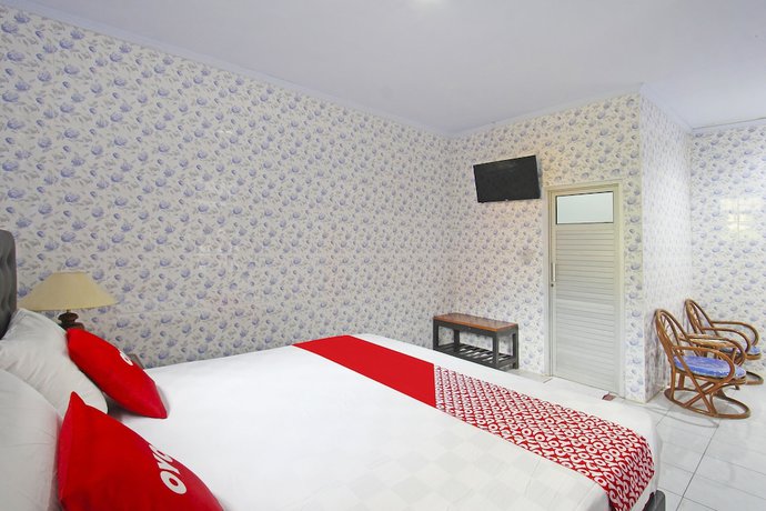 Imagen de la habitación del Hotel OYO 91516 Wisata. Foto 6