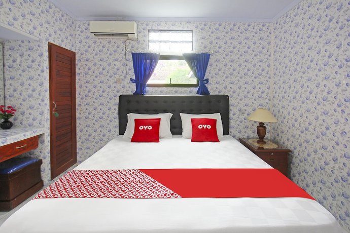 Imagen de la habitación del Hotel OYO 91516 Wisata. Foto 7