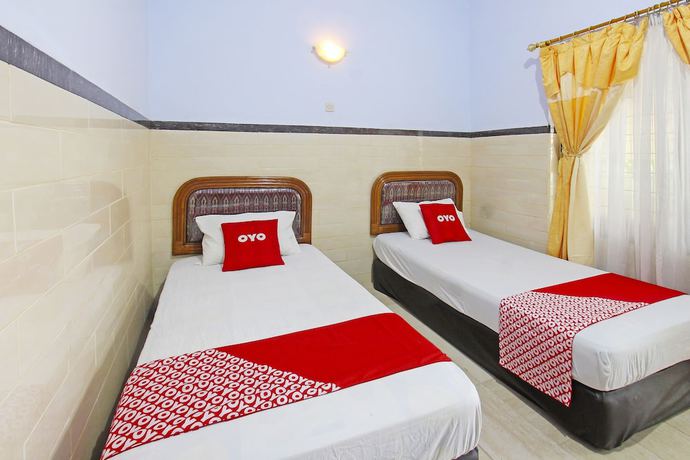 Imagen de la habitación del Hotel OYO 91516 Wisata. Foto 10