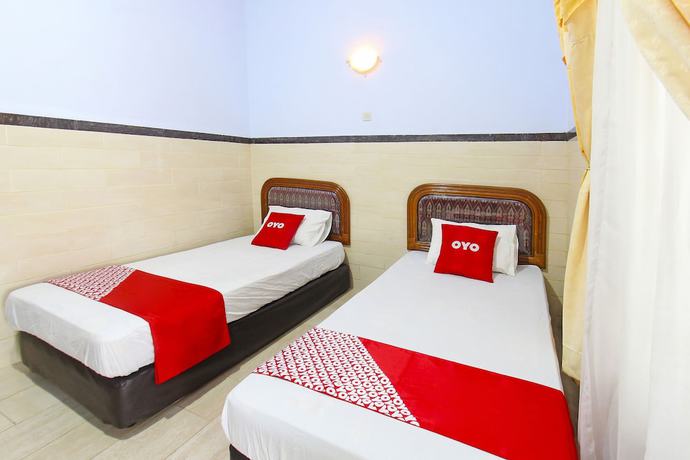 Imagen de la habitación del Hotel OYO 91516 Wisata. Foto 12