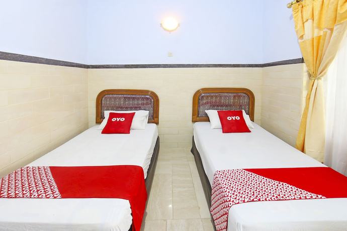 Imagen de la habitación del Hotel OYO 91516 Wisata. Foto 13