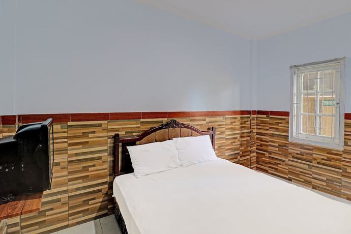 Imagen de la habitación del Hotel OYO 91678 Citarum Guest House. Foto 2
