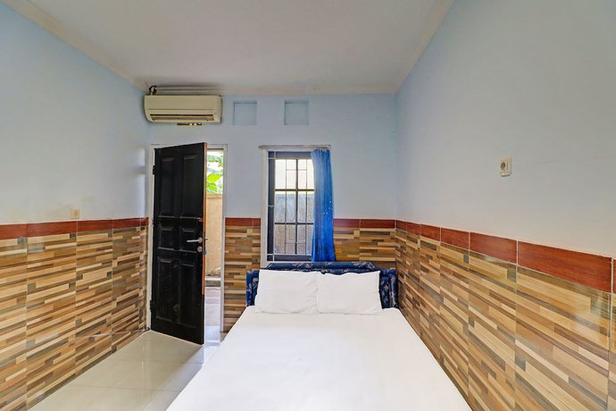 Imagen de la habitación del Hotel OYO 91678 Citarum Guest House. Foto 5