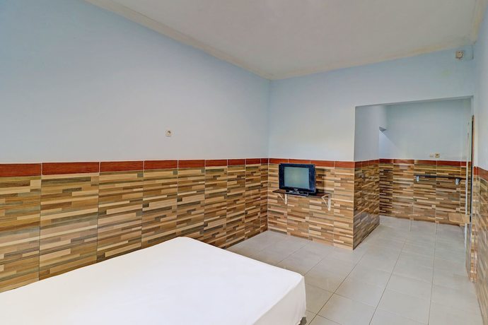 Imagen de la habitación del Hotel OYO 91678 Citarum Guest House. Foto 10