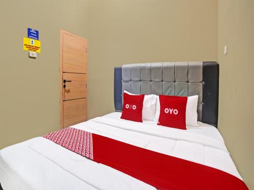 Imagen de la habitación del Hotel OYO 91689 Homestay Syariah Imah 2. Foto 18