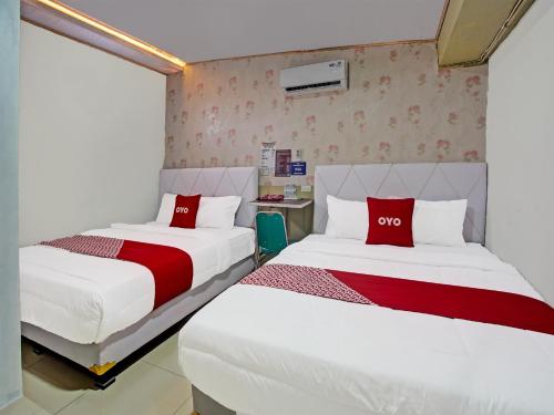 Imagen de la habitación del Hotel OYO 91689 Homestay Syariah Imah 2. Foto 20