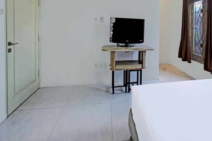 Imagen de la habitación del Hotel OYO 91739 Ayu Bypass Mansion. Foto 4