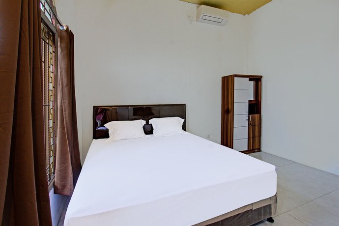 Imagen de la habitación del Hotel OYO 91739 Ayu Bypass Mansion. Foto 6