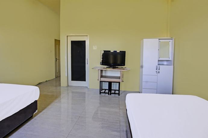 Imagen de la habitación del Hotel OYO 91739 Ayu Bypass Mansion. Foto 7