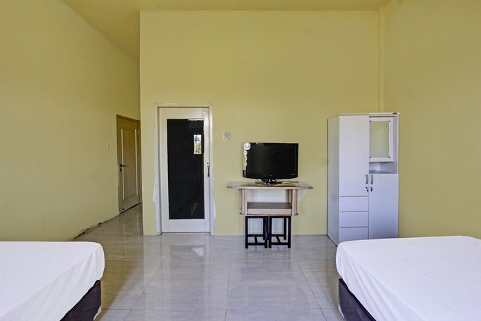 Imagen de la habitación del Hotel OYO 91739 Ayu Bypass Mansion. Foto 9