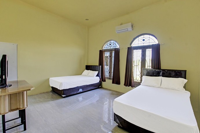 Imagen de la habitación del Hotel OYO 91739 Ayu Bypass Mansion. Foto 10