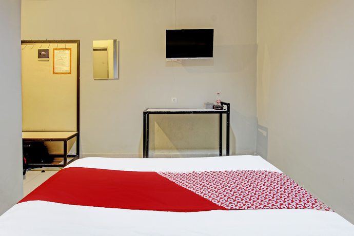 Imagen de la habitación del Hotel OYO 91819 Larich Guest House. Foto 2