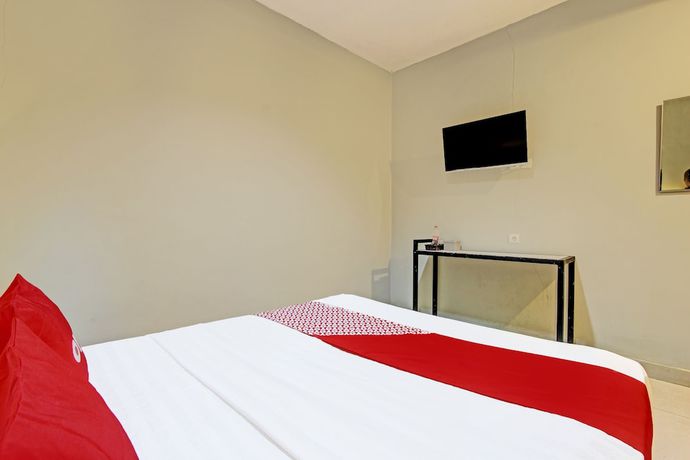 Imagen de la habitación del Hotel OYO 91819 Larich Guest House. Foto 3