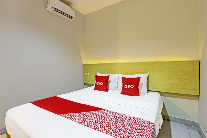 Imagen de la habitación del Hotel OYO 91819 Larich Guest House. Foto 4