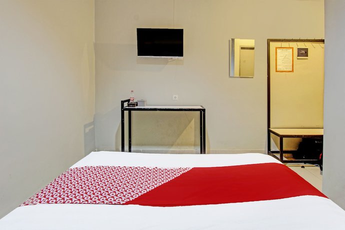Imagen de la habitación del Hotel OYO 91819 Larich Guest House. Foto 7