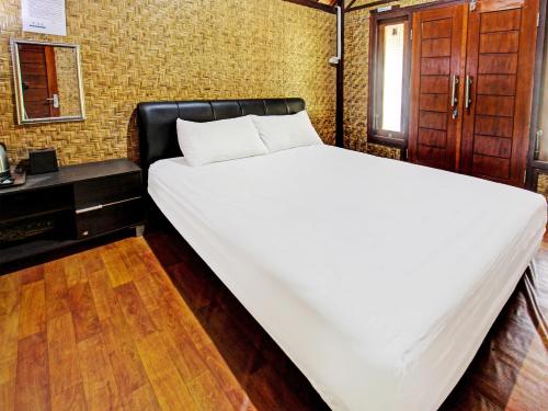 Imagen de la habitación del Hotel OYO 91830 Gemilang 2. Foto 19
