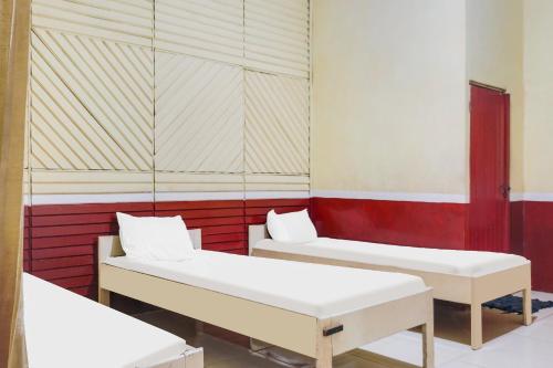 Imagen de la habitación del Hotel OYO 91833 Anggrek Daqu Syariah Kapuas, Kuala Kapuas. Foto 17