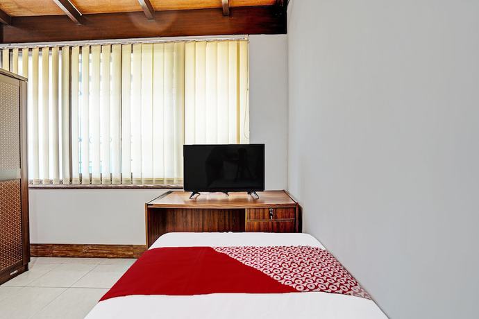 Imagen de la habitación del Hotel OYO 91846 Ms Rini Homestay Syariah. Foto 9