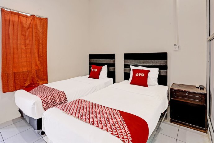 Imagen de la habitación del Hotel OYO 91861 Pemuda Kemuning Guest House. Foto 4