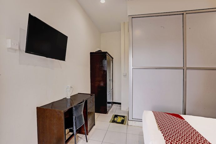 Imagen de la habitación del Hotel OYO 91861 Pemuda Kemuning Guest House. Foto 9
