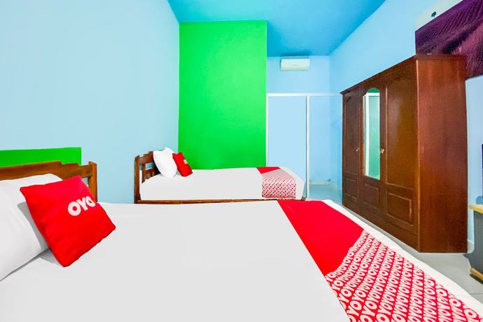 Imagen de la habitación del Hotel OYO 91861 Pemuda Kemuning Guest House. Foto 11
