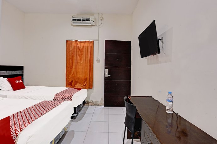 Imagen de la habitación del Hotel OYO 91861 Pemuda Kemuning Guest House. Foto 13